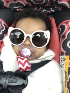 Baby Kaylynn wearing her pink infant sunglasses